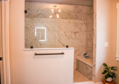 The Owasco house's master bathroom, featuring custom walk-in shower